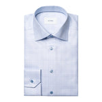 The Eton King Check Twill Shirt is a light blue, plaid-patterned dress shirt with a spread collar and buttoned cuffs, crafted from organic cotton. Neatly folded, it’s displayed on a white background.