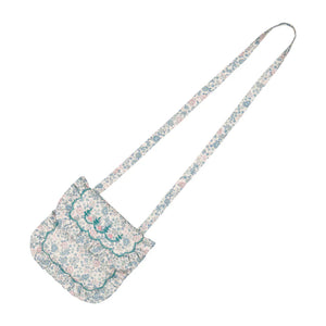 The Floral Blue Purse by Antoinette is a small, floral-patterned shoulder bag with a long strap and scalloped flap—ideal for pairing with your favorite Yse dress or completing an Antoinette-inspired outfit. Displayed on a white background.