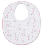 The Just Giraffes Printed Bib by Kissy Kissy features a white base with pink trim, made from soft Pima cotton and adorned with an adorable print of pink and gray giraffes along with delicate small stars—perfect for baby mealtime.