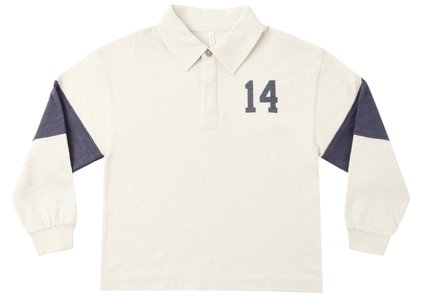 The Rylee & Cru Baby Boys’ and Boys’ Rugby Polo features long sleeves, a cream color, a classic collar with buttoned neckline, navy “14” on the chest, and navy panels on the upper sleeves for a timeless athletic look.