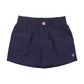 The Pink Chicken Baby Boys’ Jackson Short features navy blue cotton canvas, a comfortable pull-on elastic waistband with a front button closure, belt loops, and a small embroidered bird logo on the left leg—perfect for your little one.