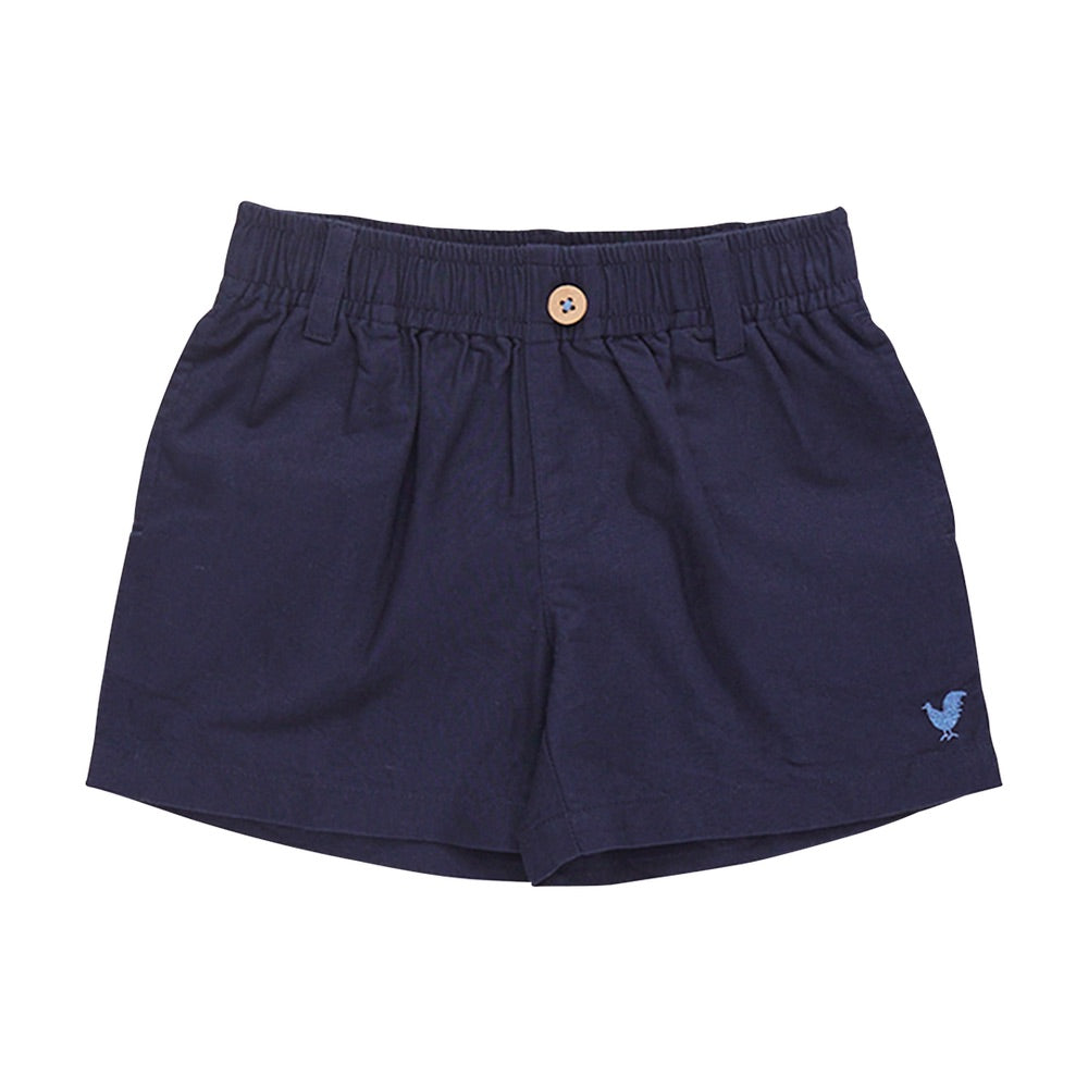 The Pink Chicken Baby Boys’ Jackson Short features navy blue cotton canvas, a comfortable pull-on elastic waistband with a front button closure, belt loops, and a small embroidered bird logo on the left leg—perfect for your little one.