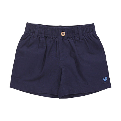 The Pink Chicken Baby Boys’ Jackson Short features navy blue cotton canvas, a comfortable pull-on elastic waistband with a front button closure, belt loops, and a small embroidered bird logo on the left leg—perfect for your little one.
