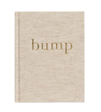 A beige fabric-covered pregnancy journal, named "Write to Me Bump A Pregnancy Story, Oatmeal" by Write To Me, features the word "bump" embossed in gold on its cover and is perfect for capturing every bump photo and weekly journal update.