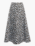 The Altuzarra Varda Skirt is an A-line silk midi skirt featuring a black and brown leopard print pattern on a light blue background, displayed on a plain white surface.