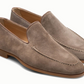 The Magnanni Lecera Loafer is a taupe suede Venetian apron toe shoe featuring stitching details and brown rubber soles, shown on a white background.