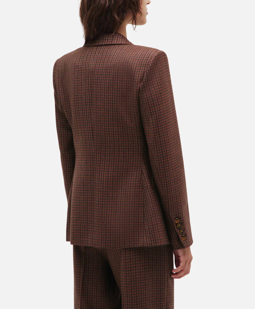 Model in the Moat Charmer Blazer by Blaze Milano, paired with matching checkered pants, creates an hourglass silhouette against a light background.