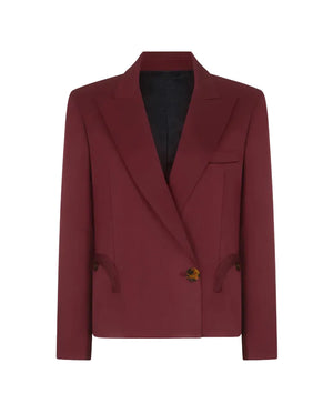The Novalis Sunfire Blazer by Blaze Milano is single-breasted, dark red, with a notched lapel, black lining, two front pockets, and brown buttons on a white background.