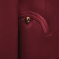 Close-up of a maroon Novalis Sunfire Blazer pocket by Blaze Milano, featuring a brown marbled button and curved stitching detail.