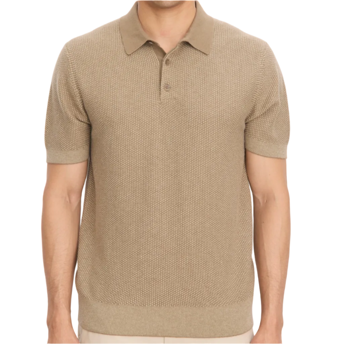 A person wearing the vince Geo Jacquard Shortsleeve Polo, a beige knit shirt with a collar and three buttons, stands against a plain white background.
