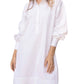 A woman wearing an Ann Mashburn Anaya Popover Dress, isolated on a white background.