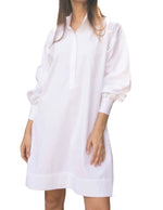 Someone is wearing the Anaya Popover Dress by Ann Mashburn, featuring puffed long sleeves and a loose fit, standing against a plain background.