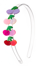 The Cherry Pink and Lilac Shades Headband by Lillies & Roses is a clear plastic hair accessory, adorned along one side with six glossy, colorful fruit shapes and green leaves—perfect for adding a springtime touch to any look.