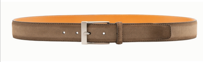 The Magnanni Telante Belt is crafted from brown suede leather with a silver brushed nickel buckle and a vibrant orange inner lining, shown laid flat.