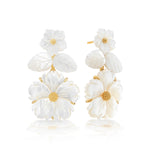 The Juliska Capucine De Wulf Mermaid Garden Convertible Floral Post Drop Earrings feature carved gold and white flowers with textured centers, adding a delicate, elegant touch to any outfit.