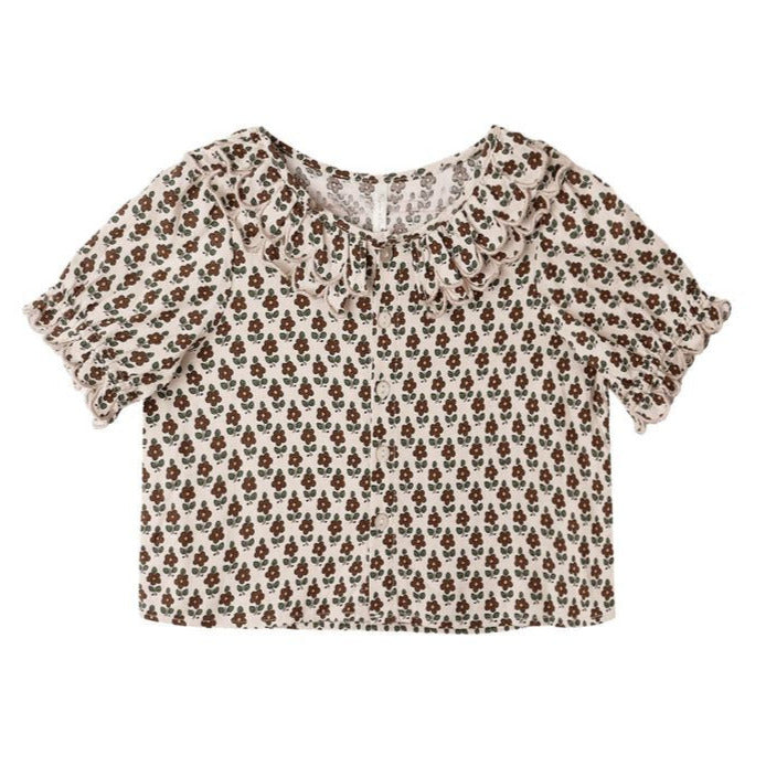 The Girls' Live Blouse by Rylee & Cru features short sleeves, a brown floral print, ruffled sleeve edges, and a scalloped collar, all shown on a flat white background.