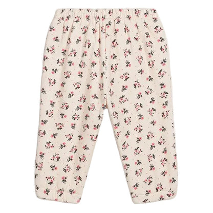 Louise Misha Girls’ Ysali Sweatpants in a cream hue feature an elasticated waist and are adorned with an allover pink and black floral print pattern. Delicate embroidery details add a charming touch to these cozy essentials.