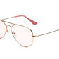 Caddis Mabuhay Readers feature gold frames with pink-tinted lenses and matching pink ear tips, elegantly displayed against a white background.