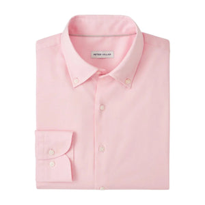 The Campbell Sport Shirt by Peter Millar is a neatly folded light pink cotton Oxford button-up with a button-down collar and visible brand label inside the neck.
