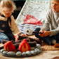 Two children playing with an Asweets Campout Camp Fire and pretending to make 'Smores.