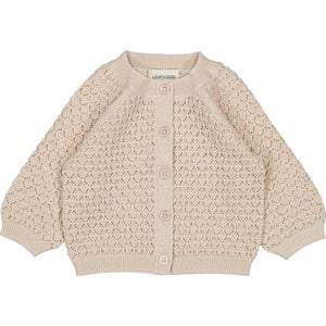 The Louis Louise Baby Girls' Sucrine Knitted Wool Blend Lurex Cardigan features a beige openwork pattern, round neck, long sleeves, ribbed trims, front buttons, and is made from a cozy wool-cotton blend.