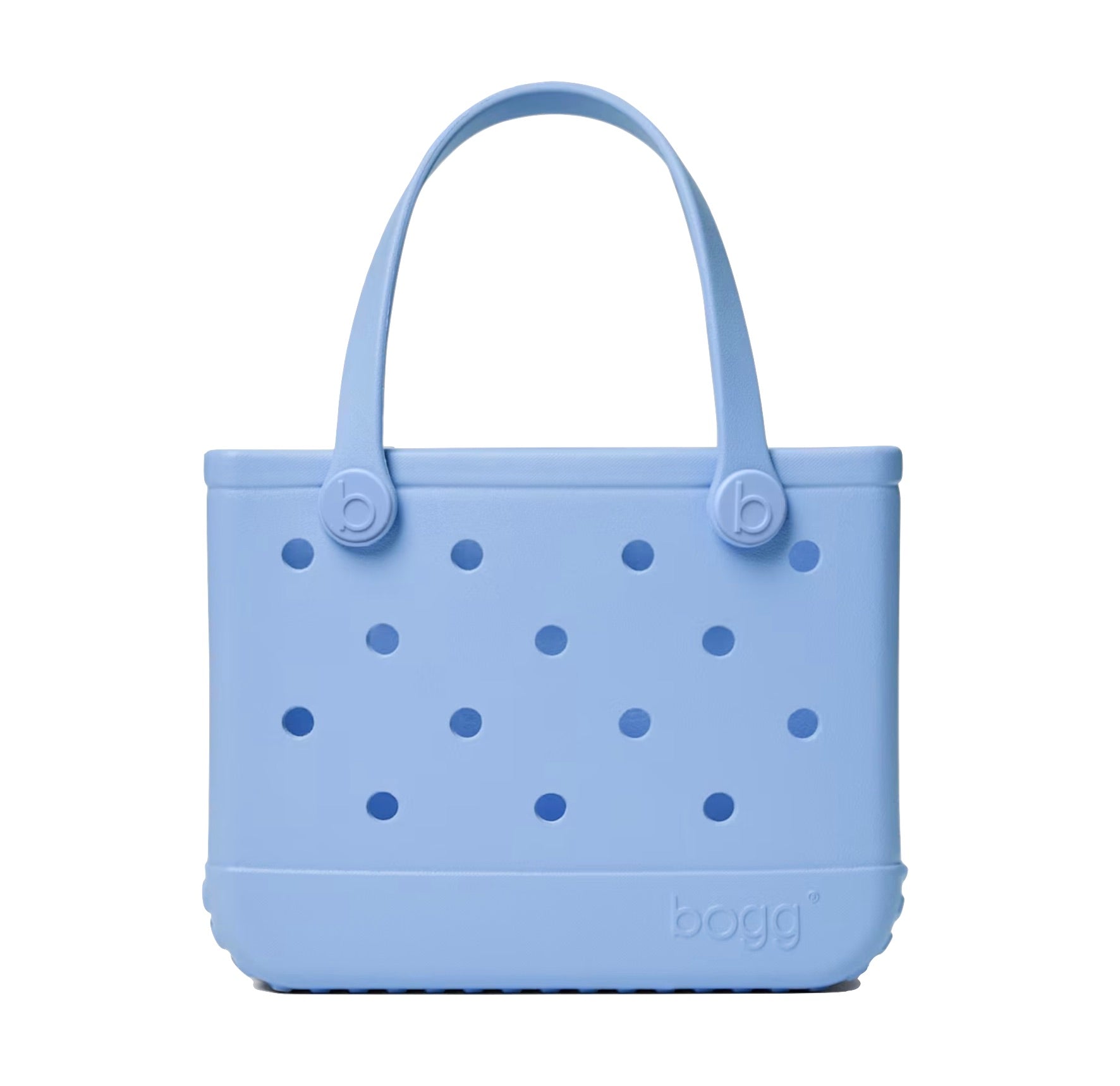 The Bitty Bogg® Bag by Bogg Bags is a compact, light blue tote featuring round holes on the sides and two sturdy handles. Crafted from a flexible, rubber-like material, this washable bag is both stylish and easy to clean.