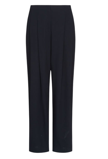 The Carries Trouser by TWP is a pair of high-rise, oversized black wool crepe trousers with front pleats and straight legs, shown on a white background.