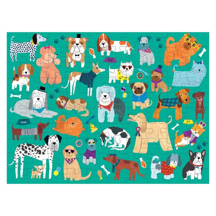 Visual depiction of different dog breeds in various poses and outfits set against a green background, formatted as the Cats and Dogs 100 Piece Double Sided Puzzle from Chronicle Books.