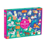 A vibrant box containing a 100-piece double-sided puzzle, showcasing charming illustrations of various cats and dogs. The box reads "Cats and Dogs 100 Piece Double Sided Puzzle" by Chronicle Books and features an eye-catching purple and green design, ideal for a fun family activity.