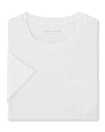The Peter Millar Crown Comfort Short-Sleeve Pocket Tee, featuring a small chest pocket and crafted from soft midweight fabric, is neatly folded and displayed on a white background.