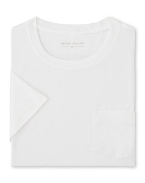 The Peter Millar Crown Comfort Short-Sleeve Pocket Tee, featuring a small chest pocket and crafted from soft midweight fabric, is neatly folded and displayed on a white background.
