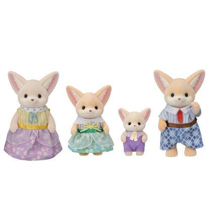 Four members of the Calico Critters Fennec Fox Family are standing in a row, wearing vibrant fabric outfits. The two larger figures stand at each end, while the two smaller figures are in the middle. Their removable clothing adds extra fun to playtime.