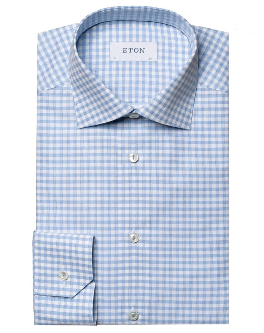 A neatly folded Eton Light Blue Checked Fine Pique Shirt, Slim Fit, featuring a spread collar and made from crease-resistant cotton piqué.