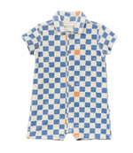 Introducing the Arsene & Les Pipelettes Baby Boys' Terry Checkered Playsuit—a short-sleeved romper crafted from soft organic cotton, featuring a blue and white checkerboard pattern with orange accents, a collar, and front buttons.