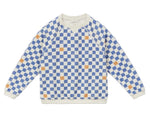 The Arsene & Les Pipelettes Boys' Checkered Terry Cloth Sweatshirt, featuring a blue and white checkerboard print with scattered orange squares, is shown laid flat on a white background.