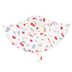 The Angel Dear Wide Brim Sunhat is crafted from organic muslin and features a secure chin strap. Decorated with red cherries, blue and pink flowers, plus green leaves, it offers stylish sun protection.