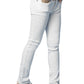 A girl in DL1961's Chloe Skinny Jeans, a white top, and white sandals poses with hands in pockets against a plain background.