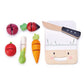 Tenderleaf Mini Chef Chopping Board from Tender Leaf Toys, with a smiling face, accompanied by a knife and various fruits and vegetables designed to be cut, all isolated on a white background.