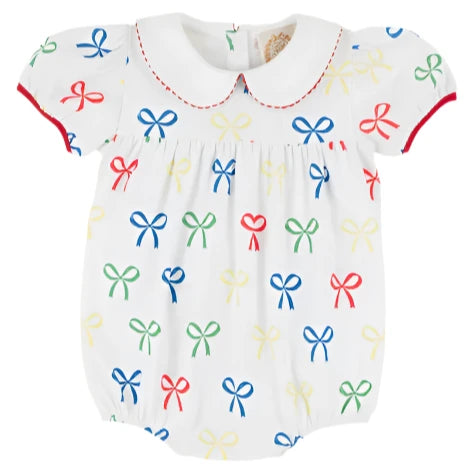 The Beaufort Bonnet Company's Baby Girls' Cindy Lou Bubble features a white design with a Peter Pan collar, red trim, and multicolored bow prints—perfect for adding charm to your little one's wardrobe.