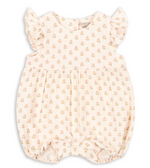 The Konges Slojd Baby Girls’ Coco Frill Romper features soft muslin fabric in light pink with a delicate small floral print and ruffled sleeves. Designed with gathered details at the waist and legs for added charm, this breathable romper ensures all-day comfort and offers easy dressing for parents.