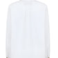 The white long-sleeve Clapotis Berber Shirt by Blaze Milano features a relaxed fit with pleats and decorative cuff buttons, ideal for summer style. The back view of this buttoned shirt exudes effortless elegance.