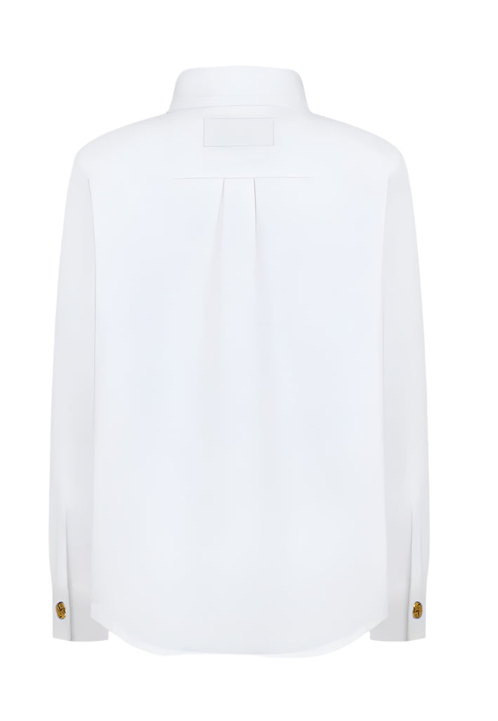 The white long-sleeve Clapotis Berber Shirt by Blaze Milano features a relaxed fit with pleats and decorative cuff buttons, ideal for summer style. The back view of this buttoned shirt exudes effortless elegance.
