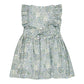 The Kidiwi Baby Girls' and Girls' Clarisse Smocked Dress features a sleeveless design, green and blue floral print, ruffled shoulders, back buttons, waist bow tie, and soft cotton poplin fabric. Shown flat on a white background.