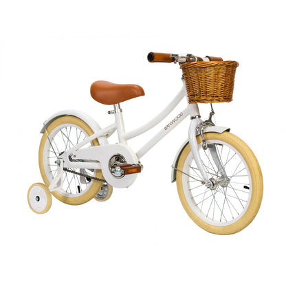 A Banwood Classic Children’s Bicycle with a wicker basket for a touch of nostalgia.