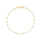 Gigi Clozeau Classic Gigi Bracelet, 6.7" and 18 carat Yellow Gold-tone bracelet with interspersed sparkling embellishments displayed against a white background, captioned with the word "sparkle.