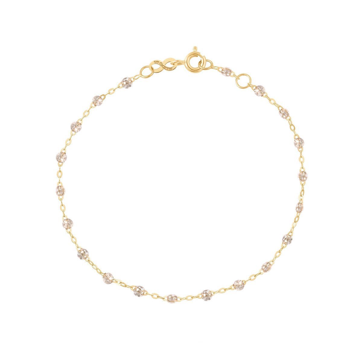 Gigi Clozeau Classic Gigi Bracelet, 6.7" and 18 carat Yellow Gold-tone bracelet with interspersed sparkling embellishments displayed against a white background, captioned with the word "sparkle.