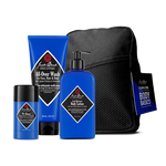 A set of Jack Black Clean and Cool Body Basics, featuring their best-selling daily body care formulas—including a signature All-Over scent body wash, lotion, deodorant, and a black mesh travel bag—arranged against a plain background.