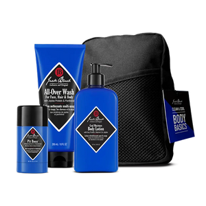 A set of Jack Black Clean and Cool Body Basics, featuring their best-selling daily body care formulas—including a signature All-Over scent body wash, lotion, deodorant, and a black mesh travel bag—arranged against a plain background.