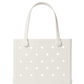 A white, rectangular Baby Bogg® Bag by Bogg Bags features round holes, two sturdy handles, and the word “bogg” embossed at the bottom right—this durable, washable tote is also easy to customize to match your style.