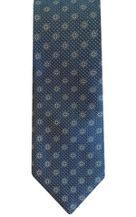 Introducing the Robert Jensen Clover Pattern Tie—a handcrafted necktie in blue, featuring a pattern of small, evenly spaced white floral designs and dots that add a touch of personal style.